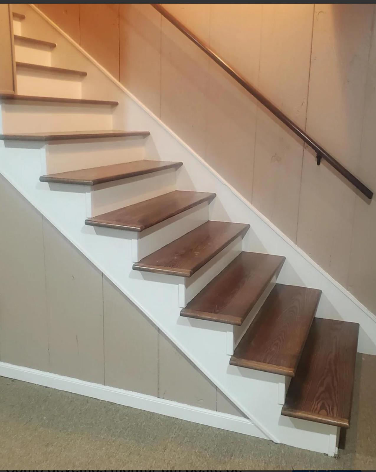 Oak hardwood stair treads with white risers in a residential stair remodel